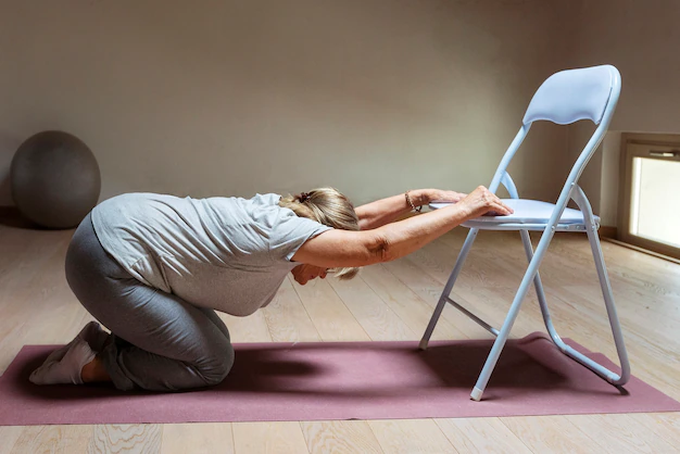 performing chair yoga